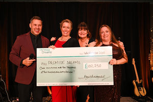 L-R Aaron James (awards host), Sally Lawson of Agent Rainmaker, Nikki Yeomans of Promise Dreams, and Dawn Bennett presenting the cheque for £102,250 to Promise Dreams 