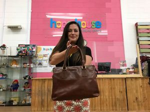 Supporting image for story: Italian handbag donated to charity shop