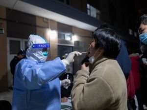 Supporting image for story: China locks down city of nine million amid new spike in cases