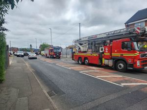 Fire crews at the scene of the blaze in Wharf Mews, Netherton. Photo: Ria Butcher