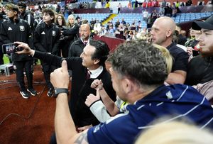 Aston Villa manager Unai Emery takes selfies with fans after the final whistle in the Premier League match at Villa Park, Birmingham. Picture date: Friday May 16, 2025.