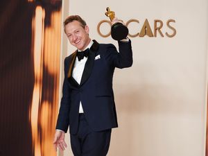 Lol Crawley, winner of the award for best cinematography for “The Brutalist,” poses in the press room at the Oscars