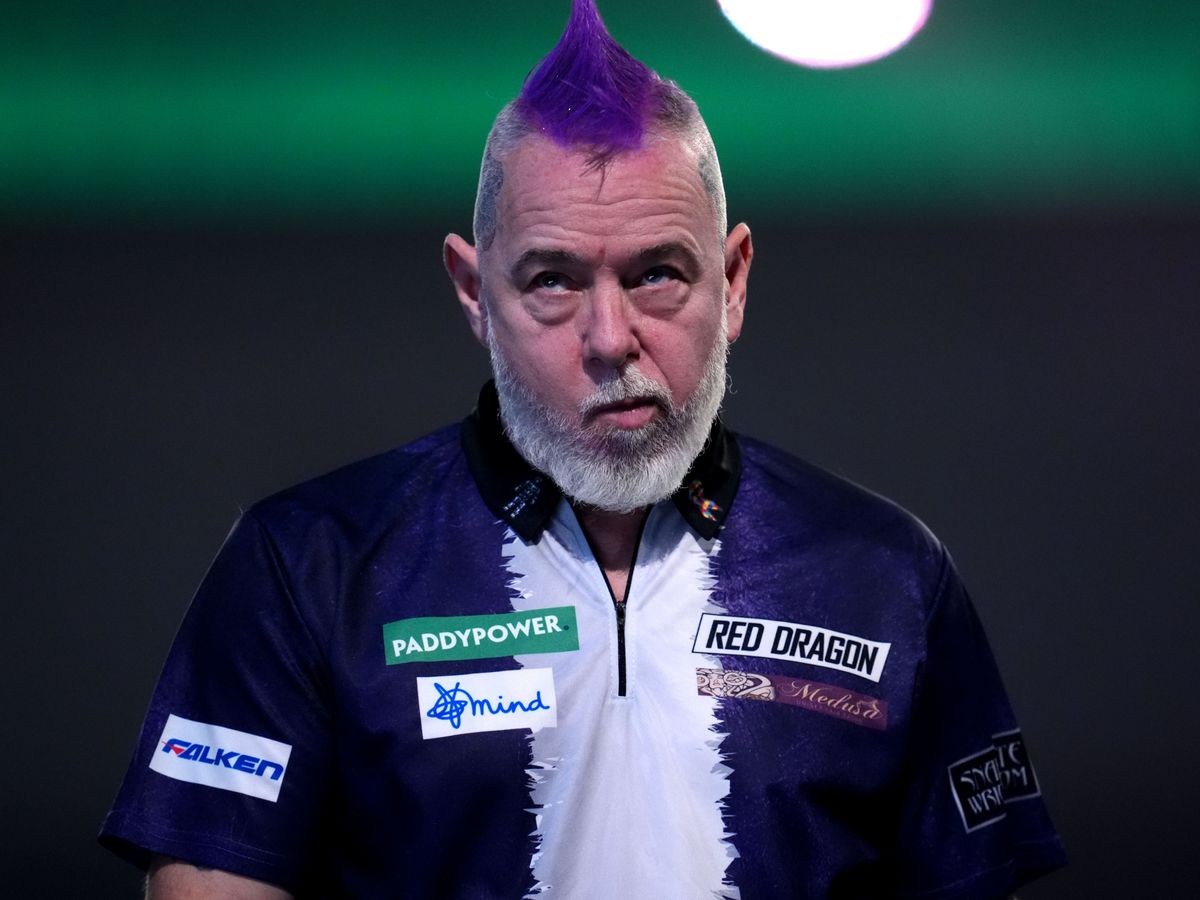 Peter Wright crashes out in round two after predicting he would win title