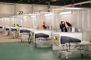Soldiers and private contractors help to convert the ExCel centre, London into a temporary NHS Nightingale hospital (Stefan Rousseau/PA)