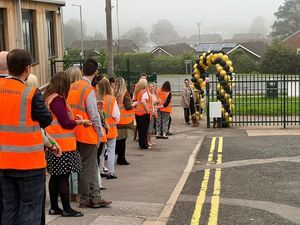 The Hart School's principal, Rachael Sandham, greeting every new pupil alongside therapy dog Rufus.