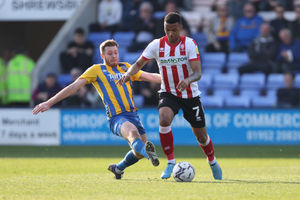 Josh Vela of Shrewsbury Town and Morgan Whittaker of Lincoln City (AMA)