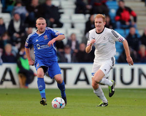 Mike Grogan of AFC Telford United and Callum Warburton of Stalybridge Celtic
