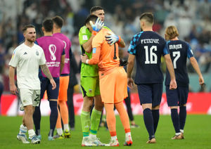 Argentina goalkeeper Emiliano Martinez consoles Croatia goalkeeper Dominik Livakovic