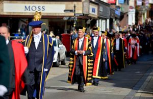 Dr Gyles Brandreth in the procession through the town
