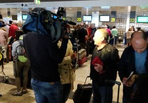 Television crews descended on the airport