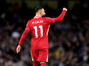 Mohamed Salah celebrates scoring the opening goal for Liverpool against Manchester City