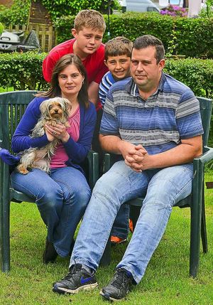 Neil and Chris Parton with Matthew and Alex at home in Norton