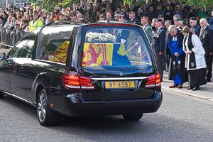 The hearse carrying the coffin of Queen Elizabeth II, draped with the Royal Standard of Scotland