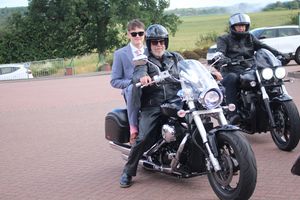 Kaiden Hicks arriving via motorcycle