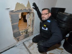 Supporting image for story: 'Two for the price of one' as drugs raid on Telford house reveals Shawshank-style hole to next-door  