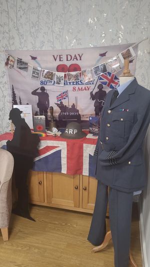 Collin's uniform stands proudly non display in reception at Woodcroft