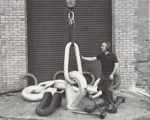 Business in the chainmaking trade was being generated by North Sea oil. The photograph shows chainmaker Isaiah Preston in Cradley Heath with a master link assembly in April 1977.