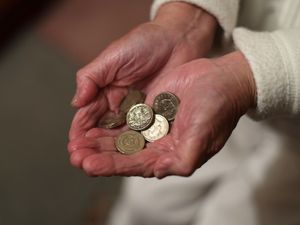A woman holding coins