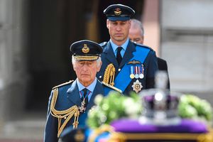 King Charles III and the Prince of Wales follow the coffin of Queen Elizabeth II
