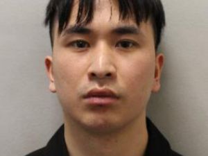 The police custody photo of Zhenhao Zou