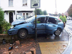 Supporting image for story: Two hurt as car hits garden wall