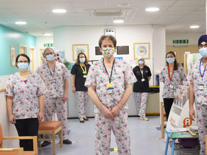 Supporting image for story: Consultants daring to wear floral scrubs to boost funds