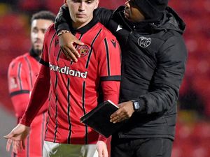 Darren Byfield consoles Oisin McEntee at the final whistle.