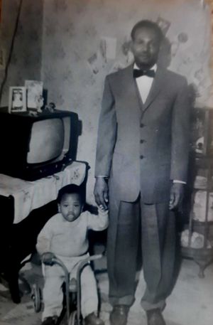 Hezlon pictured with his son in the 1960s 