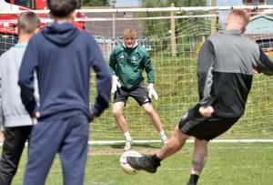 Manchester Utd goalkeeper, Fred Heath, is put to the test