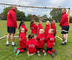 Manger, Cameron Foggin (right) and coach Sam Pedley (left) with the Old Wulfrunians U7 Girls Team