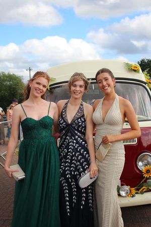 Eleanor Cowing, Arrabella Sutton Dunn and Gabrielle Thornton arriving to prom in their vintage VW Camper Van decorated in sunflowers.