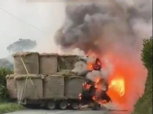 Supporting image for story: Fire crews battle tractor blaze on rural road