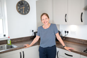 B&DWM - SGB-38585 - Cathy McAllister in her David Wilson Home