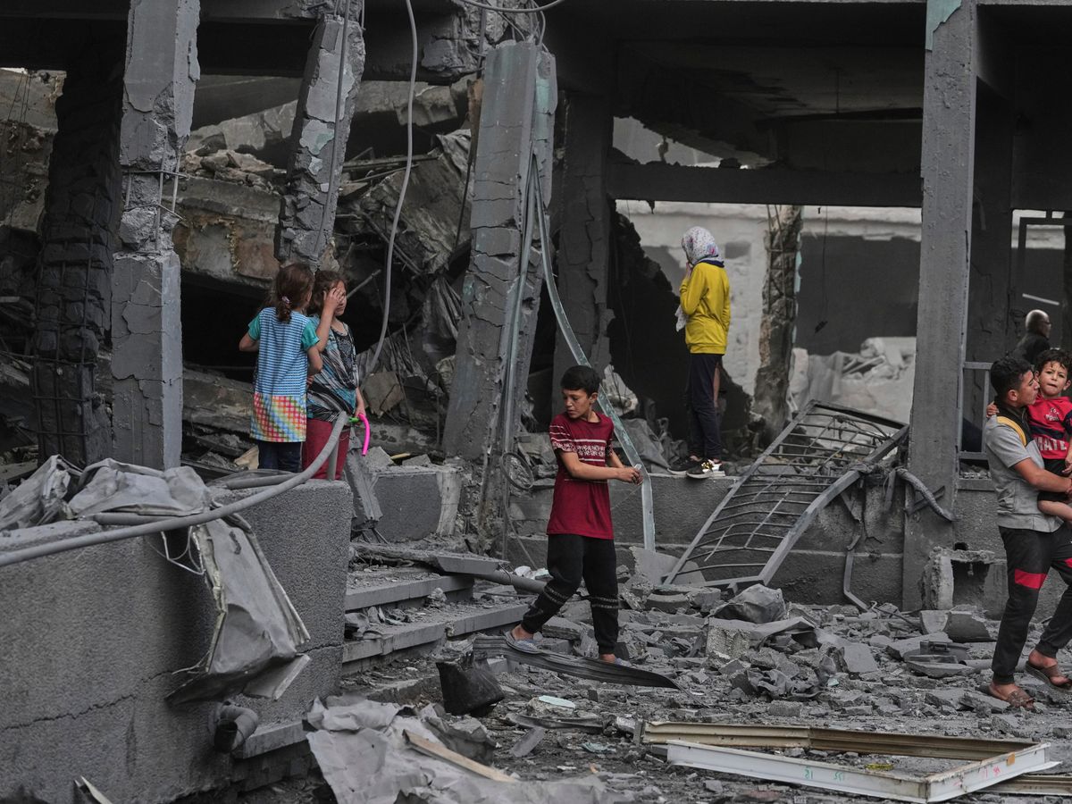Israeli strike kills 14 Palestinians including women and children in Gaza camp