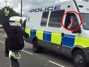 Supporting image for story: Police officer appears to swear at illegal rider