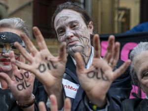 Supporting image for story: Climate activists in ‘zombie dance’ protest outside insurance offices
