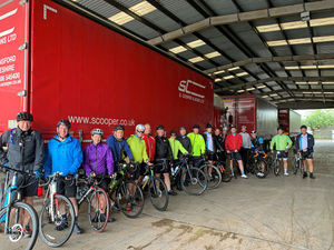 Supporting image for story: Cyclists brave rain to raise thousands for charity