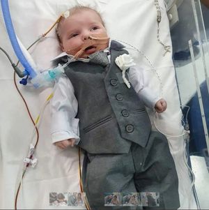 Baby Rudie dressed up for his parents' wedding