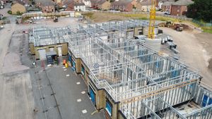 Pre-manufactured frames and panels have started to be lifted into place. Photo: McPhillips