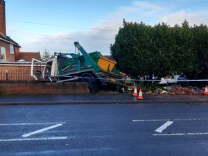 Supporting image for story: Skip lorry breaks through brick wall off busy Telford road
