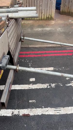 When the man returns, he finds that the scaffolders have blocked him into a parking space with their poles. Photo: Kennedy News and Media