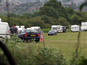 Supporting image for story: Travellers set up camp close to park