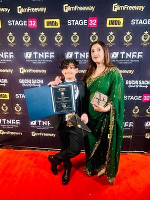 Dudley son and mother Rita and Reece Jagpal-Mohan pictured with their award win in  New York.