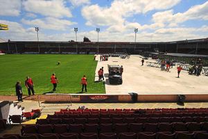 A protective floor is put down to stop the pitch getting damaged by concert-goers