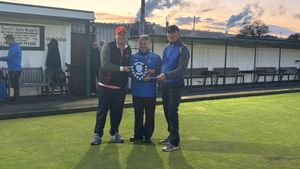Doubles delight for Andrew Armstrong and (right) Kevin Nicholas, with Chirk’s Meurig Davies holding the trophy