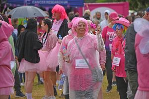 The rain didn't keep this runner away, she threw one a rain mac and kept going!