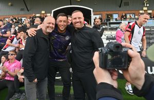 Assistant Lee Vaughan celebrating with Hednesford owner Craig Gwilt (left) and manager Gavin Hurren (right).