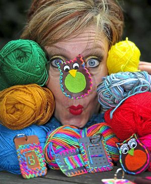 Francesca Cox from Walsall Leather Museum shows off an owl badge