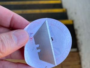 Supporting image for story: Warning after razor blades found hidden under far-right stickers at train station 