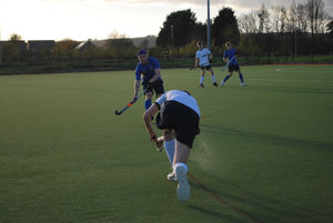 Stourport's bandana'd Harry Mac closes down a Shrewsbury midfielder